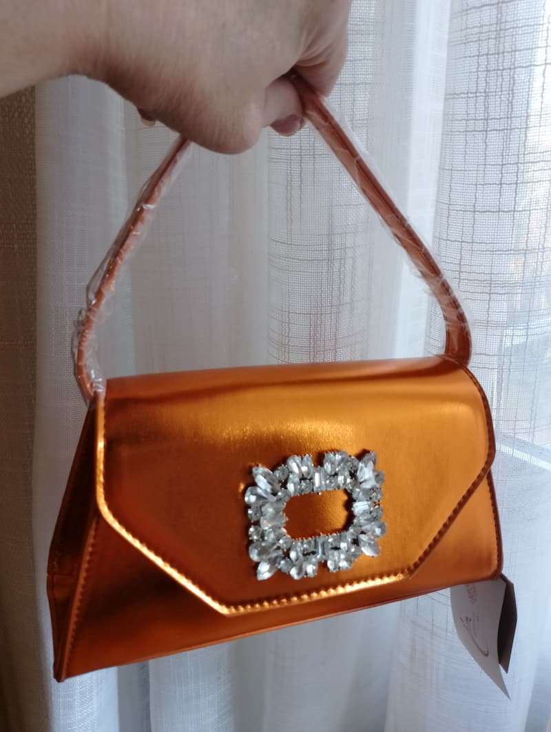 Sac Nolie BONITALUZ orange - vue profil pochette rigide avec chaîne dorée